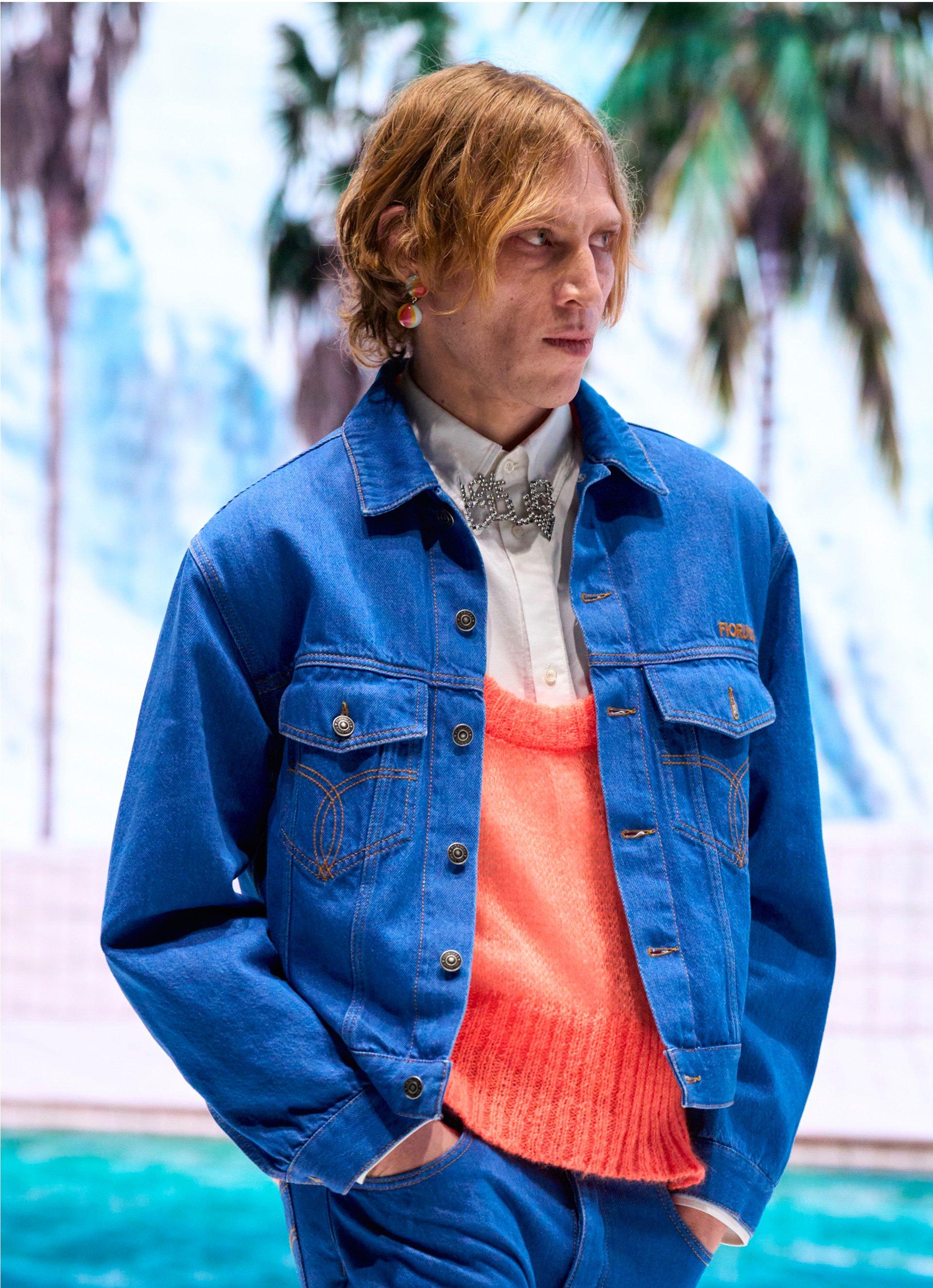 Model wears the Logo Denim Jacket in Ocean Blue.